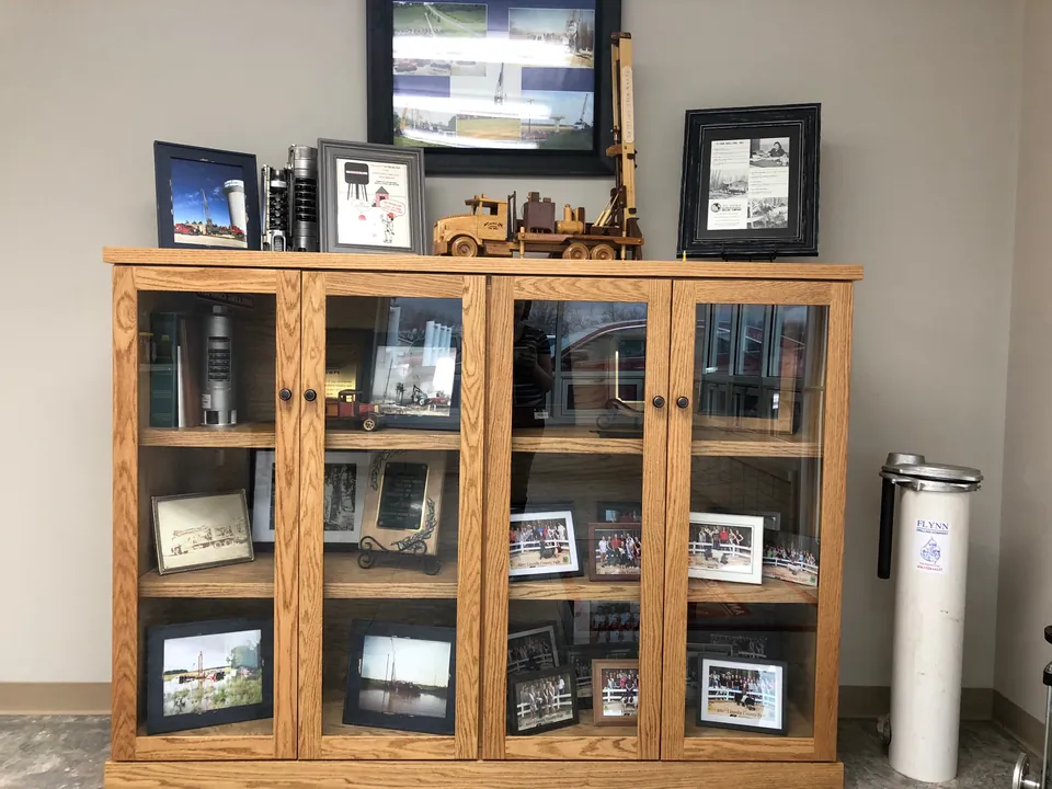 The display cabinet in the Troy office holding seventy years of company history