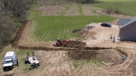 A geothermal loop field being trenched in on a Missouri property