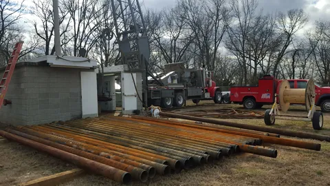 Well casing laid out at a public water supply site