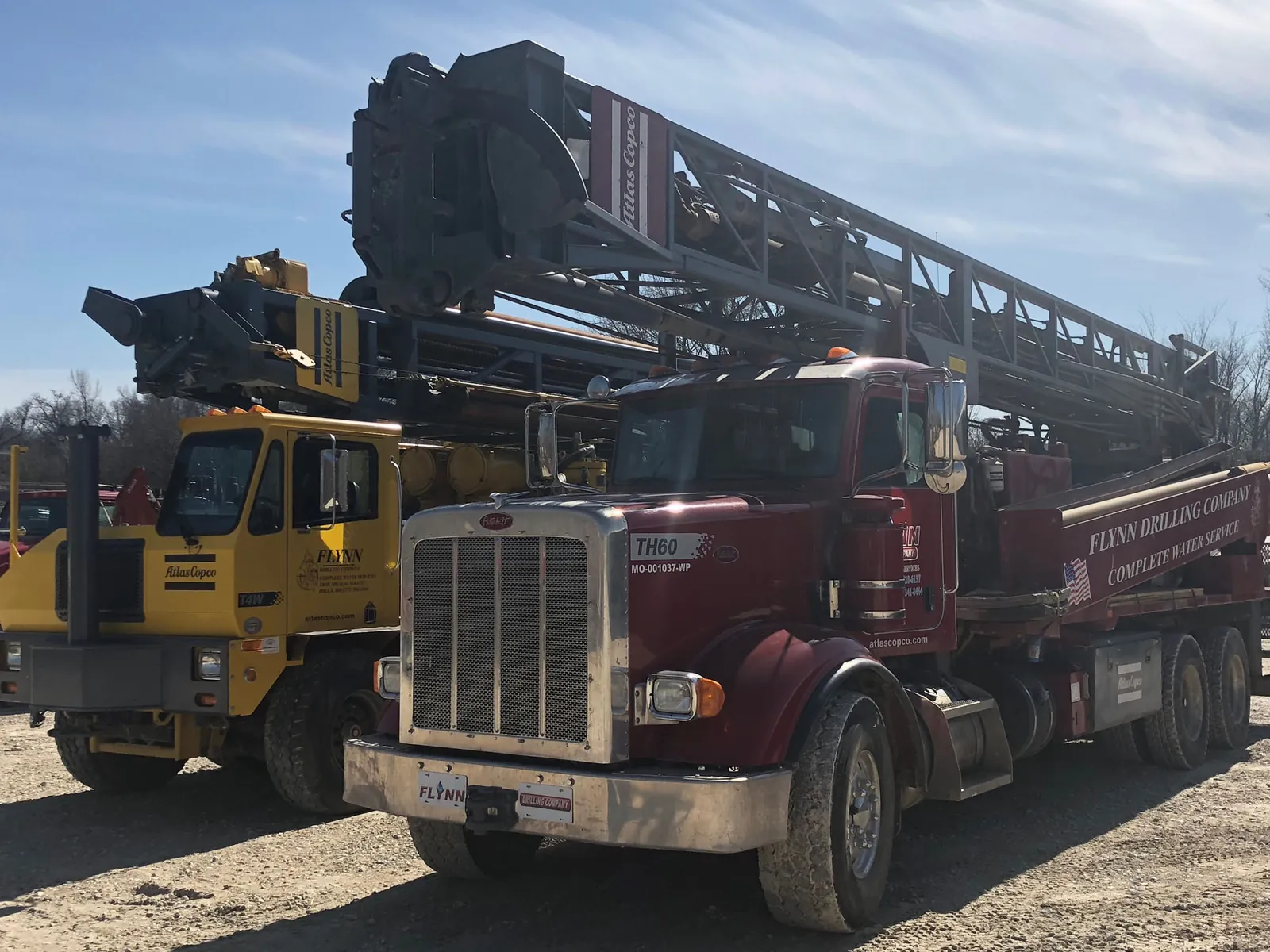 A Flynn Drilling Peterbilt TH60 drill rig parked in the Troy yard