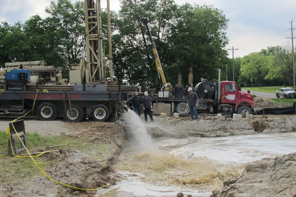 A Flynn Drilling crew developing a newly drilled well